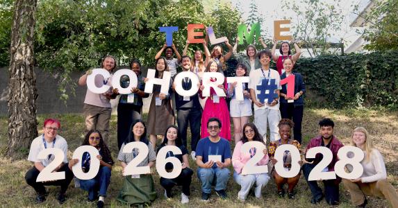 Photo of the 22 students holding a sign that says: Cohort #2026-2028