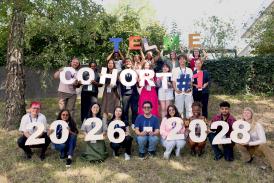 Photo of the 22 students holding a sign that says: Cohort #2026-2028
